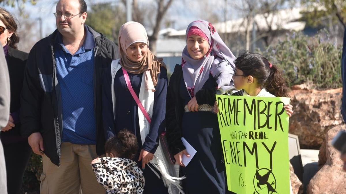 The Ali family joins elected officials and the Los Banos community at Henry Miller Plaza in Los Banos on Saturday to welcome 12-year-old Eman Ali, second from right, to her new home after an extensive process of getting her into the United States in the wake of President Donald Trump’s executive order restricting travel from seven Muslim-majority countries.