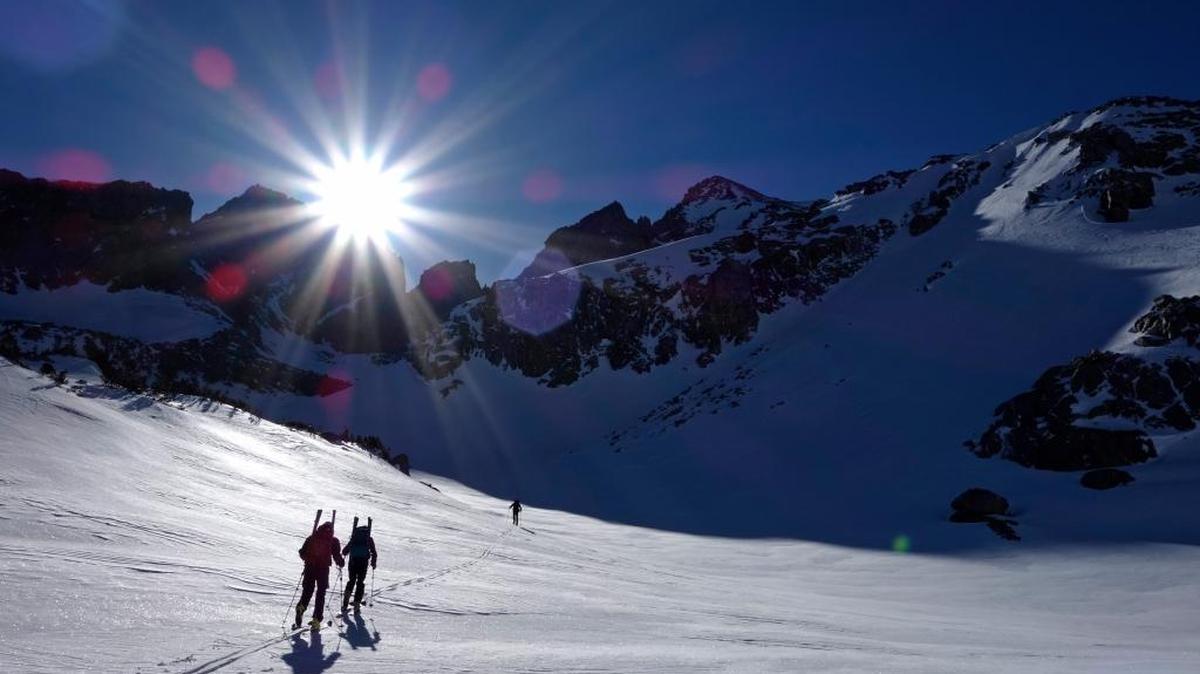 In this photo taken April 1, 2017, members of a California Cooperative Snow Survey team ski toward Bishop Pass in Inyo National Forest near Bishop, Calif. In the Sierra Nevada, snowpack is 176 percent of normal for this time of year but is unlikely to break the record for snow set in the 1982-83 season. (AP Photo/Brian Melley)