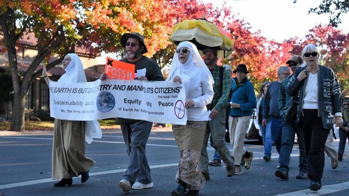 A group of about 40 people marched up and down M Street in Merced on Sunday, Nov. 29, 2015, on the eve of the United Nations Climate Change Conference in Paris to raise awareness about a variety of environmental issues.