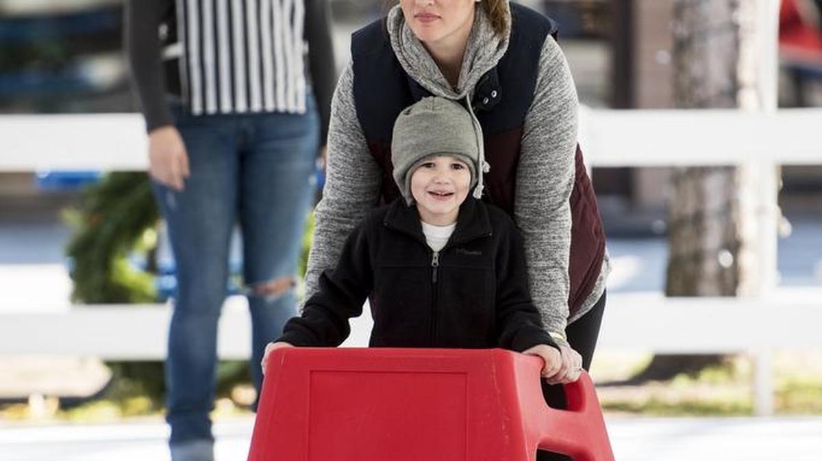 Katie Hull, 32, of Atwater skates with son Jimmy Hull, 5, at a synthetic ice rink at the First Baptist Church in Merced on Friday. The rink will be open for public skating until Dec. 23, 2016.