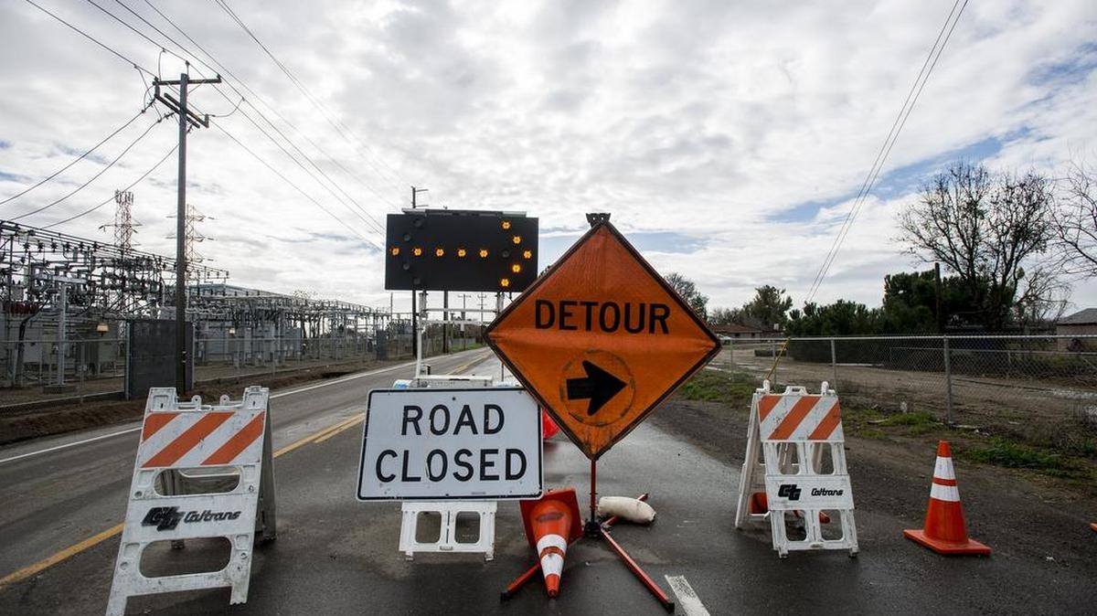 The southbound lane of Highway 59 is closed at the intersection of Highway 59 and Dickenson Ferry Road and Mission Avenue in rural Merced County, Calif., on Thursday, Jan. 19, 2017. The California Department of Transportation is preparing for inclement weather in the area expected over the next few days.