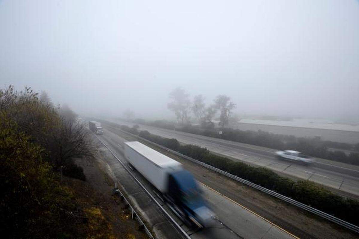 Highway 99 motorists cope with dense fog during the morning commute in this file photo.