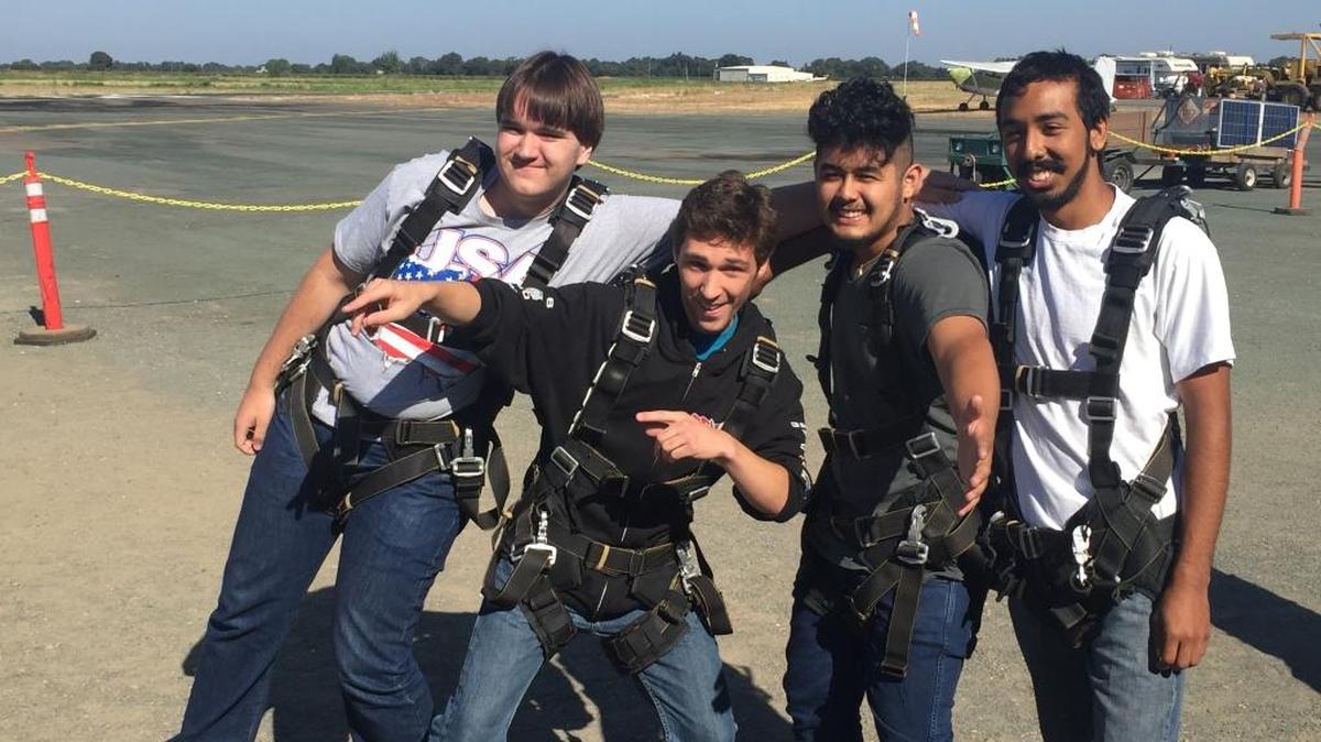 This Aug. 6, 2016, photo provided by Francine Salazar Turner shows her son Tyler Turner, second from left, with his friends Casey Nelson, left, Quinan Munoz, second from right, and Mario Munoz just prior to his fatal skydiving jump in Lodi, Calif.