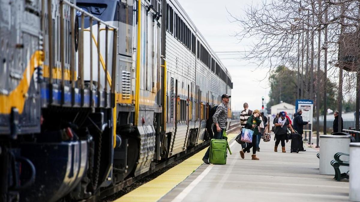 Passengers disembark an Amtrak train at Merced station on Tuesday. Amtrak is surveying San Joaquin Valley riders in an attempt to better accommodate weekday travelers.