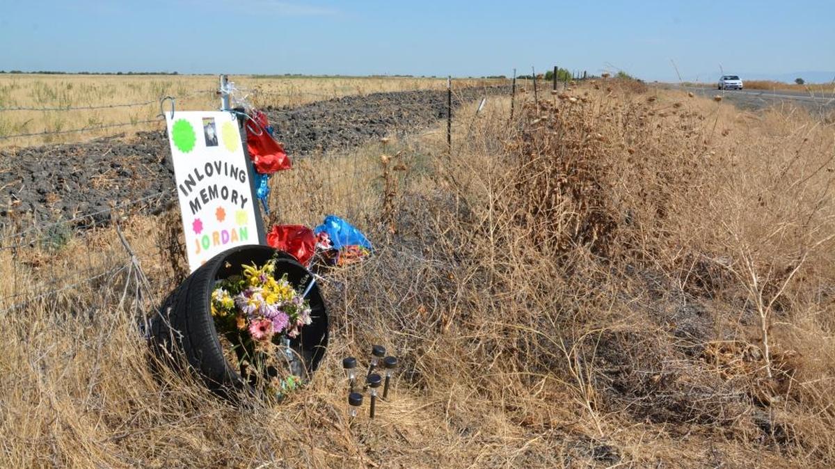 A memorial stands for 8-year-old Jordan Bueno of Visalia on Tuesday at the site of a single-vehicle crash in which he died as a passenger Sunday off Highway 165. His mother, Vanessa Bueno, was arrested on felony DUI and manslaughter charges.