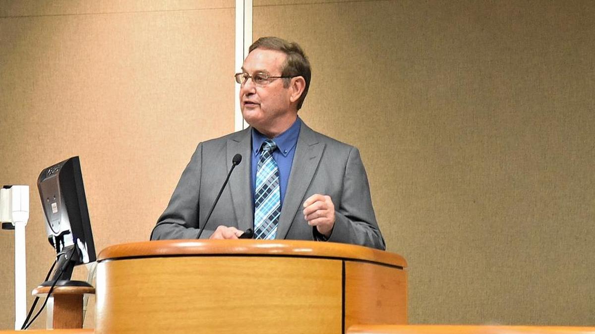 Don Ouchley, deputy general manager for energy resources for Merced Irrigation District, gives a report to board members on a proposed project to build 13 miles of new power lines during a meeting at Merced Civic Center on Tuesday, May 10, 2016.