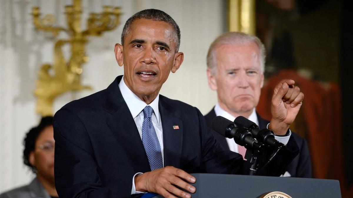 President Barack Obama announces executive actions intended to expand background checks for firearms purchases Tuesday at the White House. With him is Vice President Joe Biden.