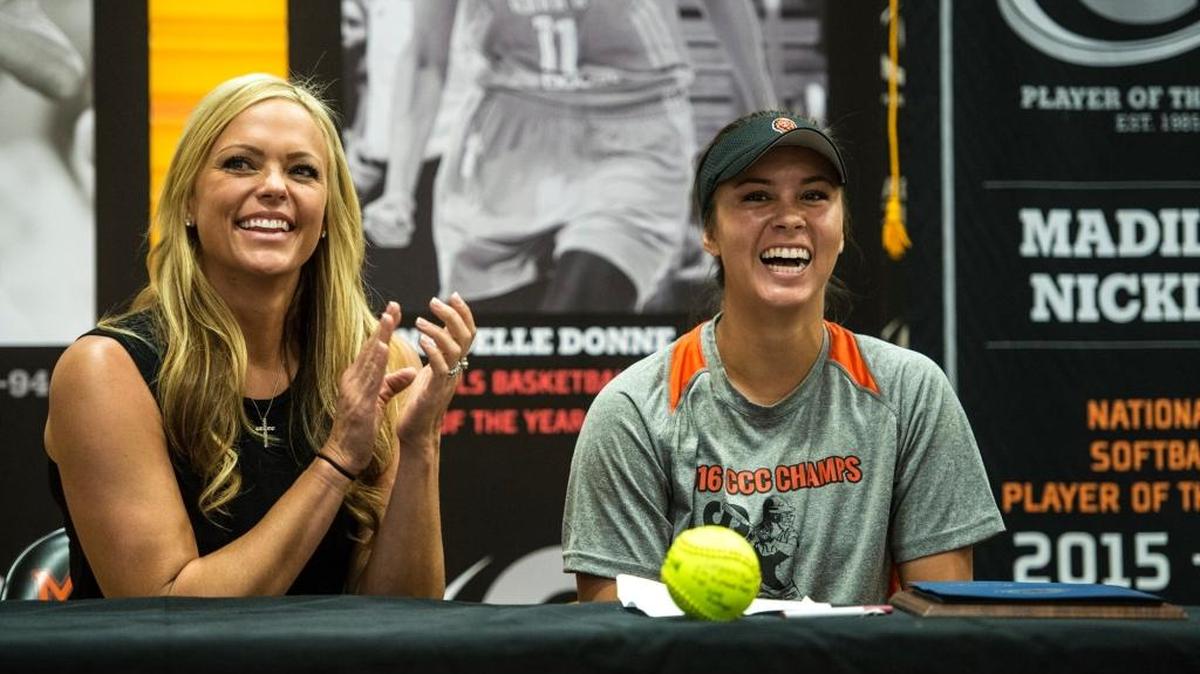 Former team USA softball player and two-time Olympian Jennie Finch, left, laughs with recent Merced High School graduate and Gatorade National Softball Player of the Year Madilyn Nickles during a ceremony at Merced High School on June 8.
