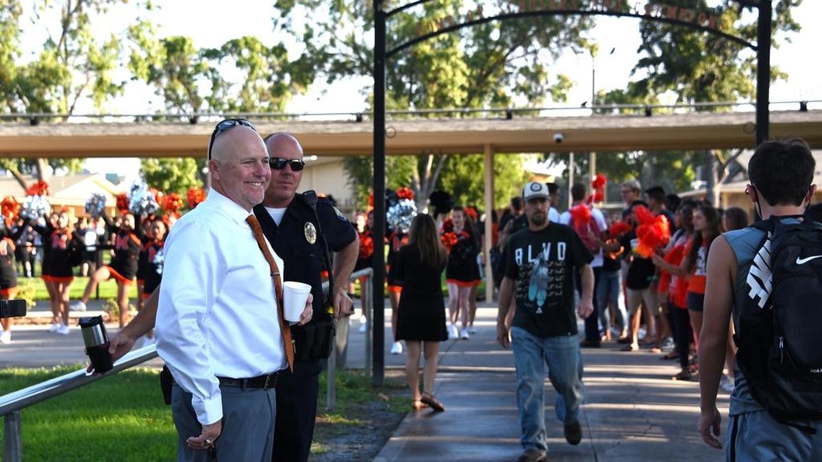Merced High School’s new principal, Jon Schaefer, greets students on the first day of school on Monday, Aug. 15, 2016 in Merced, Calif.