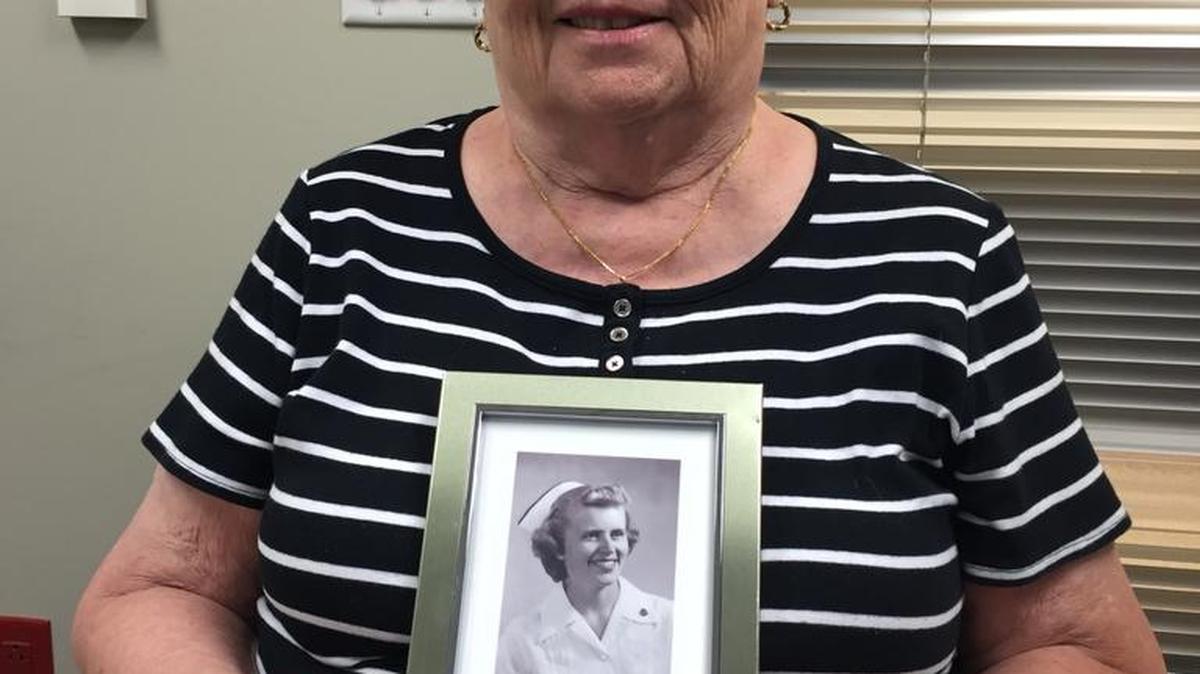 Mary Ellen DuPertuis, 81, holds a picture of herself when she graduated from nursing school in 1956. She has been a registered nurse and resident in Merced for the past 60 years and retired Sept. 1.