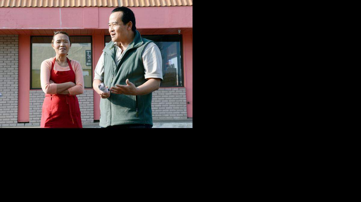 
Vannak Sao, 48, who co-owns Donut King with his wife, Teri, also 48, expresses frustration on Wednesday while standing in the parking lot of his business, which has been named in an Americans with Disabilities Act lawsuit.
