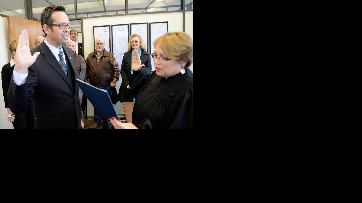 
County Assessor Barbara Levey, right, administers the oath of office to Daron McDaniel, who was sworn in as supervisor for Merced County’s District 3 on Monday in Merced.

