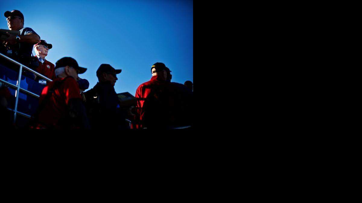 
World War II veteran Eugene Mould, 91, of Modesto, looks out over the runway while boarding the Central Valley Honor Flight at Castle Airport in Atwater on Monday. The flight, consisting of more than 70 combat veterans, including 16 from Merced County, headed to Washington D.C. for a three-day trip.

