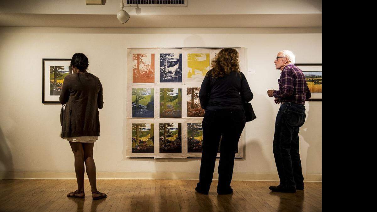 
Guests walk through the ninth annual art of printmaking exhibit during a reception at the Merced Multicultural Arts Center earlier this month. 
