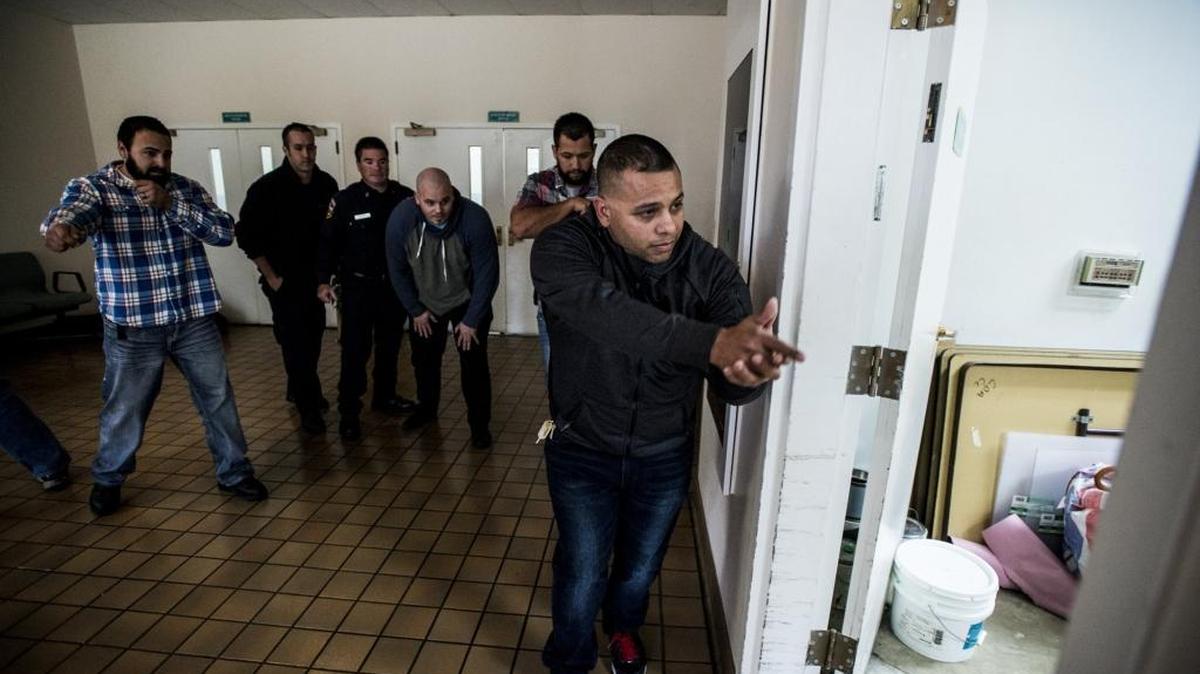 Merced County Sheriff’s Deputy Raul Garcia, right, prepares to enter a room with fellow first responders during an active-shooter scenario while participating in Unified Response to Violent Incident training at the Atwater Community Center on Thursday, Dec. 10, 2015. The training is designed to help Merced County first responders work together in the event of an emergency.