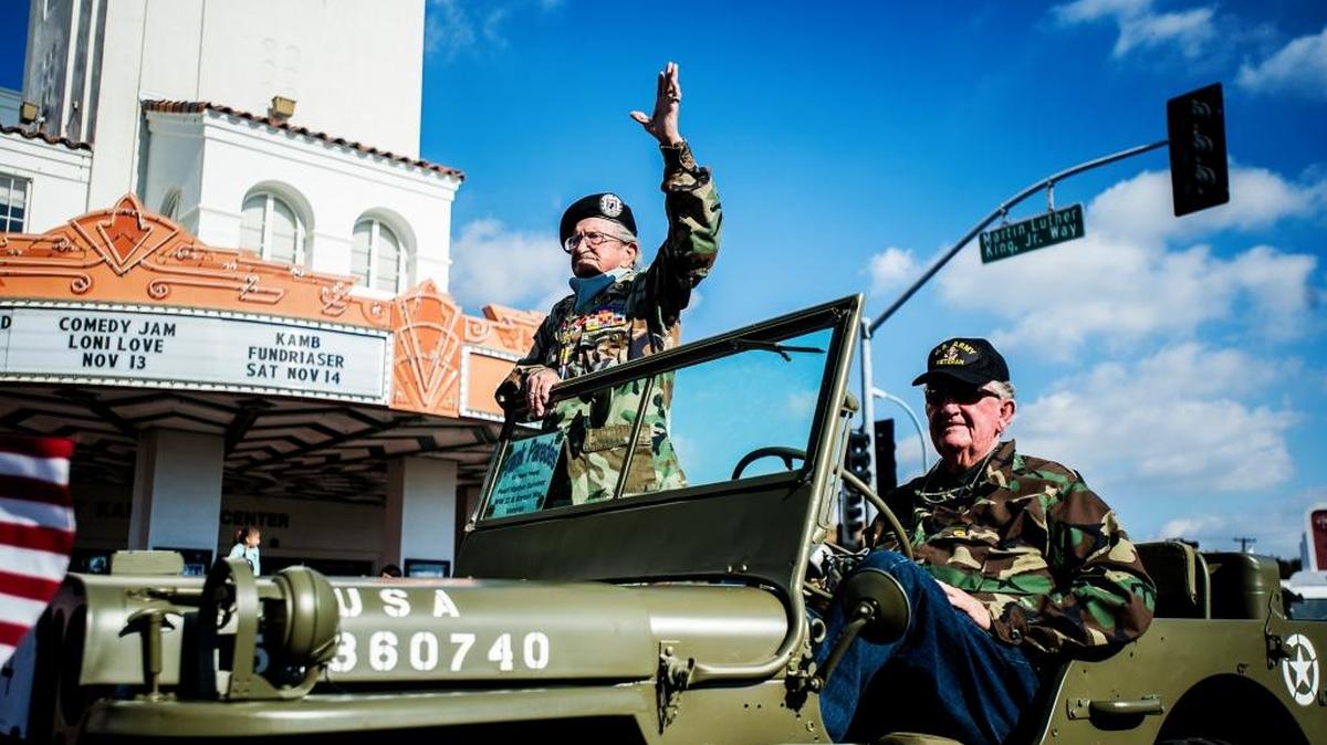 Atwater resident and World War II veteran Frank Paredes, 95, waves to the crowd during the annual Veterans Day Parade downtown Wednesday, Nov. 11, 2015. Paredes served in the Korean War and is a survivor of the Pearl Harbor attack. Thousands lined Main Street to honor the men and women who have served their country.
