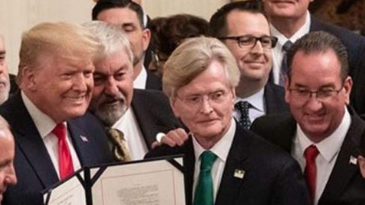 U.S. President Donald Trump, far left, is shown Friday, Jan. 24, 2020 with Atwater Mayor Paul Creighton, first from right, and Merced Mayor Mike Murphy, second from right.
