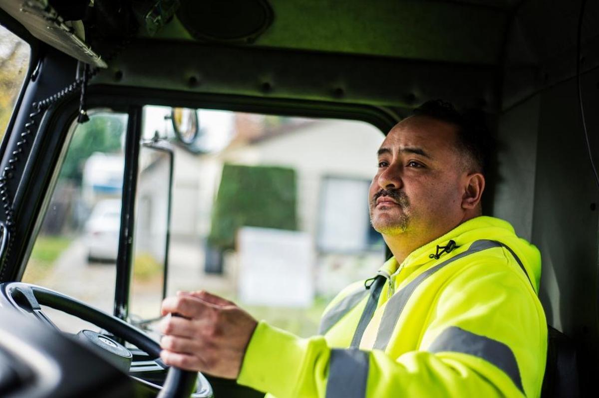 David Soto, 40, of Merced watches video from the mechanical arm camera while collecting green waste in Merced on Tuesday, Dec. 8, 2015. 