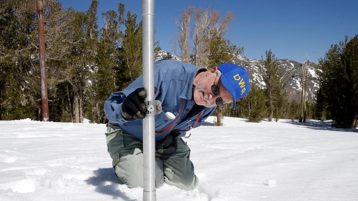Frank Gehrke, chief of the California Cooperative Snow Surveys Program for the Department of Water Resources, checks the depth of the snowpack as he does a snow survey at Leavitt Lake near Bridgeport in April. The Sierra Nevada snowpack measured above average for this time of year, but it’s not enough to make a dent in California’s stubborn four-year drought, state water managers said Wednesday, Dec. 23.