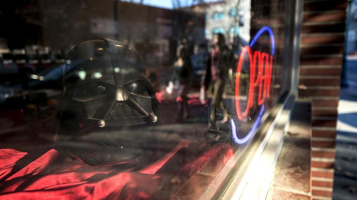 A Darth Vader helmet sits in the window of Red Sky Comics, 617 W. Main St. in Merced, on Wednesday, Dec. 16, 2015. The seventh film of the “Star Wars” franchise, titled “Star Wars: The Force Awakens,” will be released in movie theaters Thursday, Dec. 17, 2015.