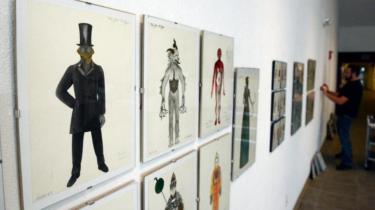 
Designs for the Philip Glass opera “The Voyage” and other costume design mockups of Dunya Ramicova, a UC Merced professor, go up at the Merced Multicultural Arts Center on Tuesday. The work is part of the center’s latest exhibit, which will have an opening reception from 5:30 to 7:30 Friday at the 645 W. Main St. gallery.
