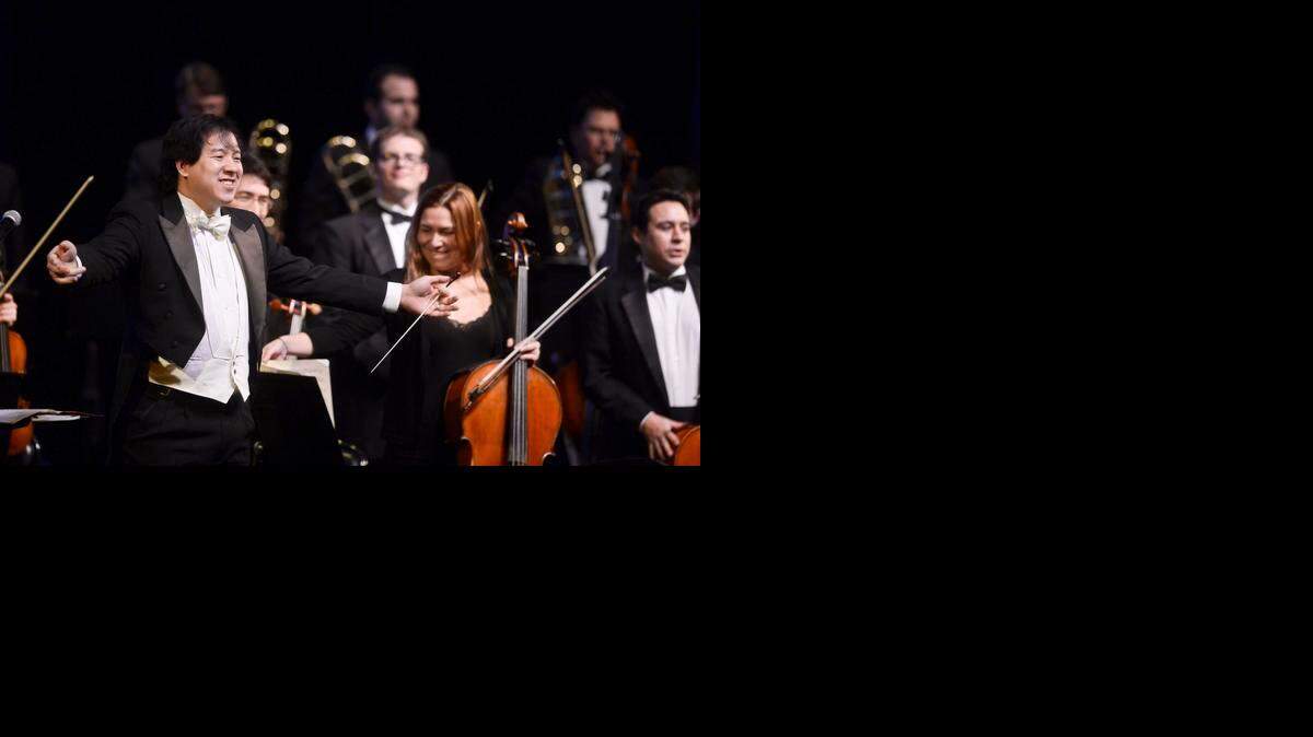 
Conductor Ming Luke turns to the crowd during the Merced Symphony’s annual pops concert at the Merced Theatre late last month.
