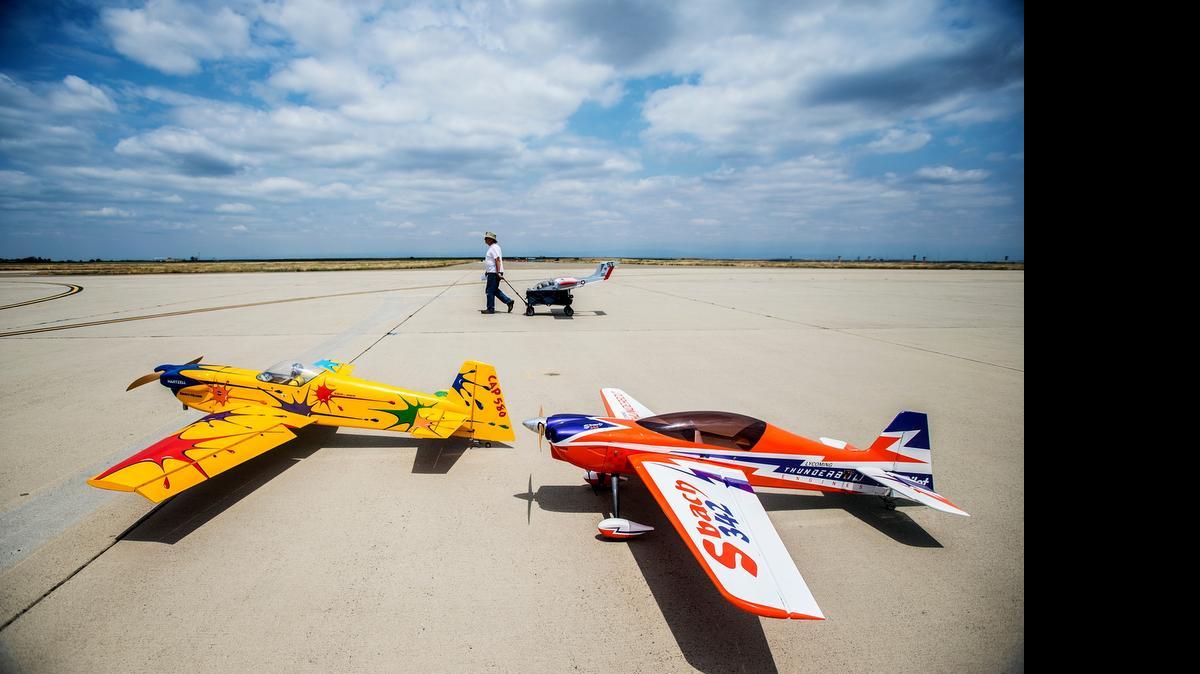 
Model aircraft sit on the runway during the West Coast Festival of Giants at Castle Airport in Atwater, Calif., Thursday, May 21, 2015. The four-day event will run through Sunday and features over 200 model aircraft including turbine-powered aircraft which can reach speeds of over 200 mph.
