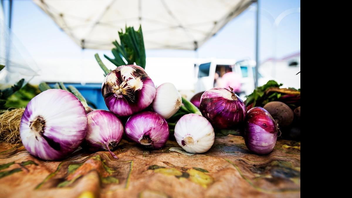 
Red onions are available for purchase from Turlock’s Meelee’s Farm during the Merced farmers market off West 16th Street between M and Canal streets in downtown Merced on Saturday.
