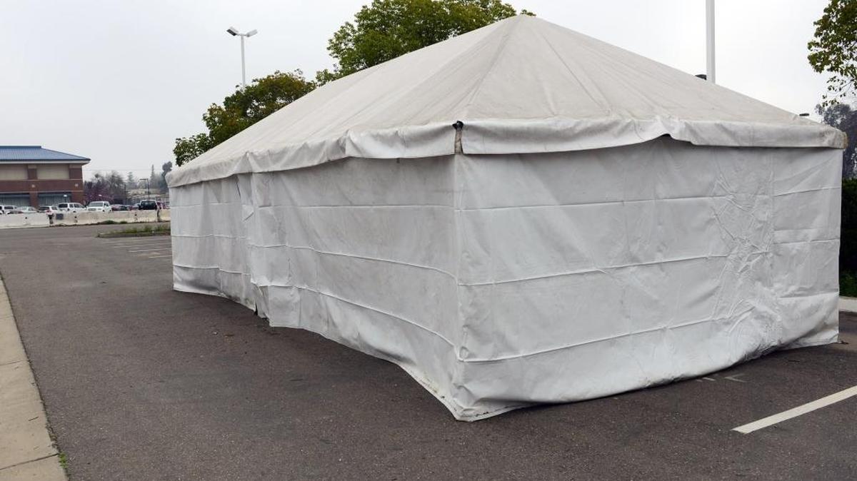 The warming center tent stands in a Merced parking lot on Feb. 19 near the Merced County Public Health building and D Street shelter, both on 15th Street.