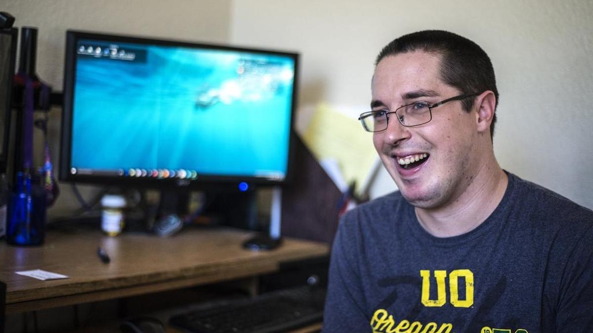 
Chris Cox speaks about his experience growing up with cerebral palsy, a congenital disorder that affects the nervous system, at his home in Atwater.
