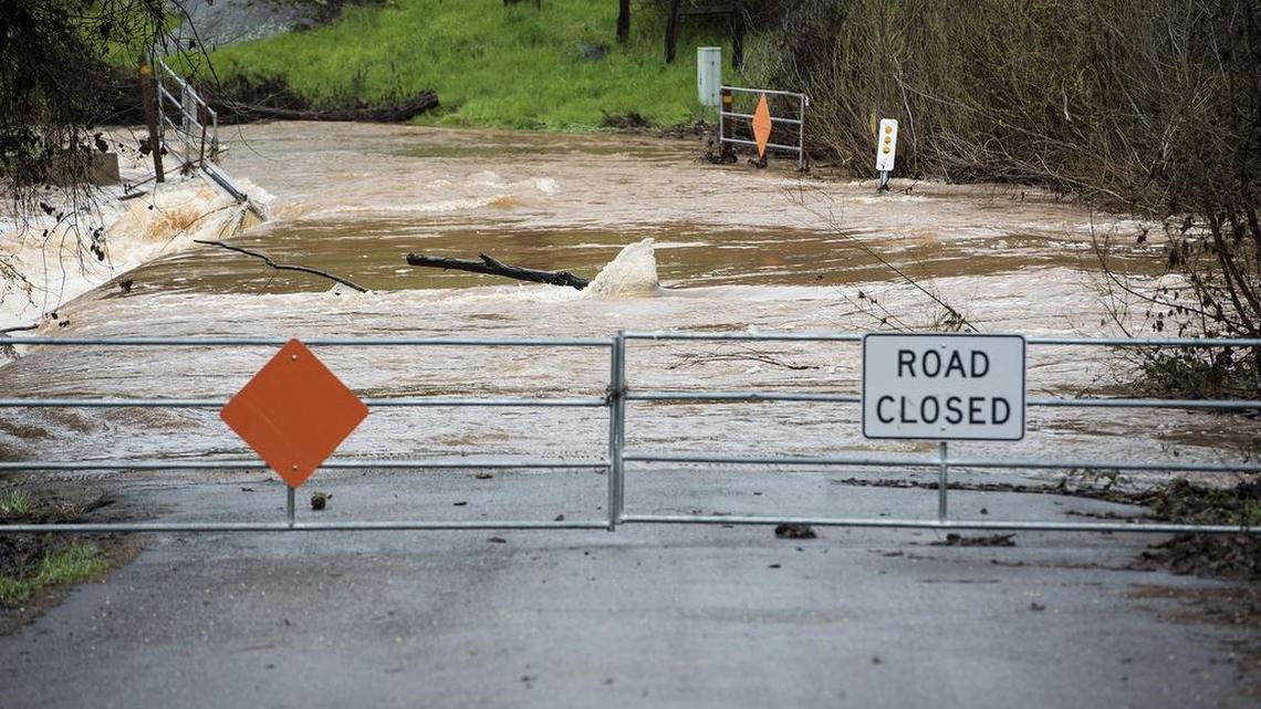 Water floods Mormon Bar Crossing in Mariposa, Calif., on Thursday, March 22, 2018.