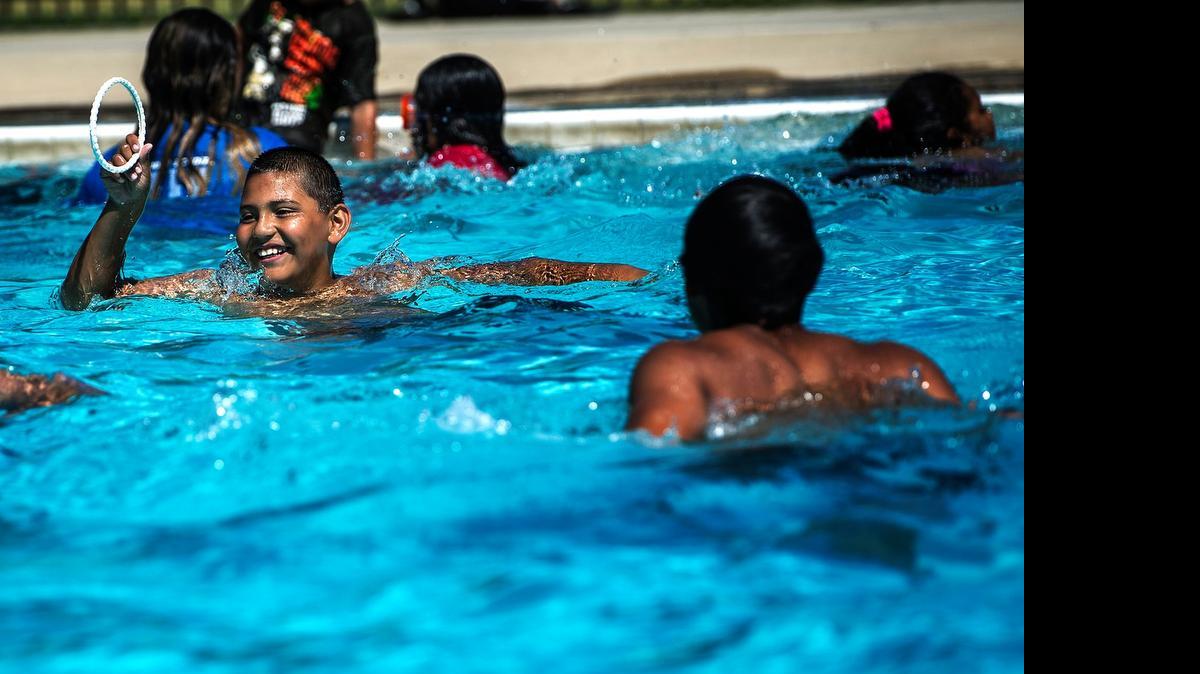 
Jonathan Diaz, 9, of Merced prepares to throw a dive ring for friends at the McNamara Community Park pool last month. Swimming for children will be free at McNamara Park every Friday through Aug. 7 thanks to a donation from the Merced Satellite Rotary Club, officials announced this week.
