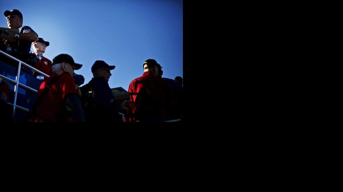 
World War II veteran Eugene Mould, 91, of Modesto, looks out over the runway while boarding the Central Valley Honor Flight for World War II veterans at Castle Airport in Atwater, Calif., Monday. The flight, consisting of over 70 combat veterans including 16 from Merced County, is headed to Washington D.C. for a three-day trip.
