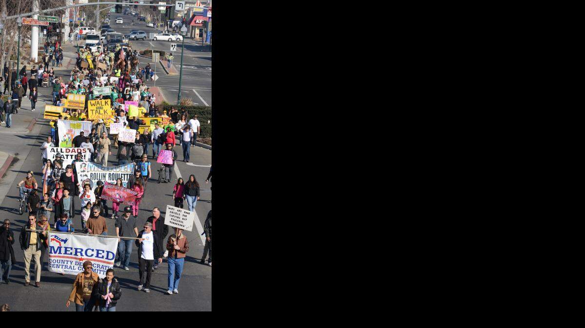 
The Martin Luther King Jr. march moves along Martin Luther King Jr. Way in Merced in 2013. 

