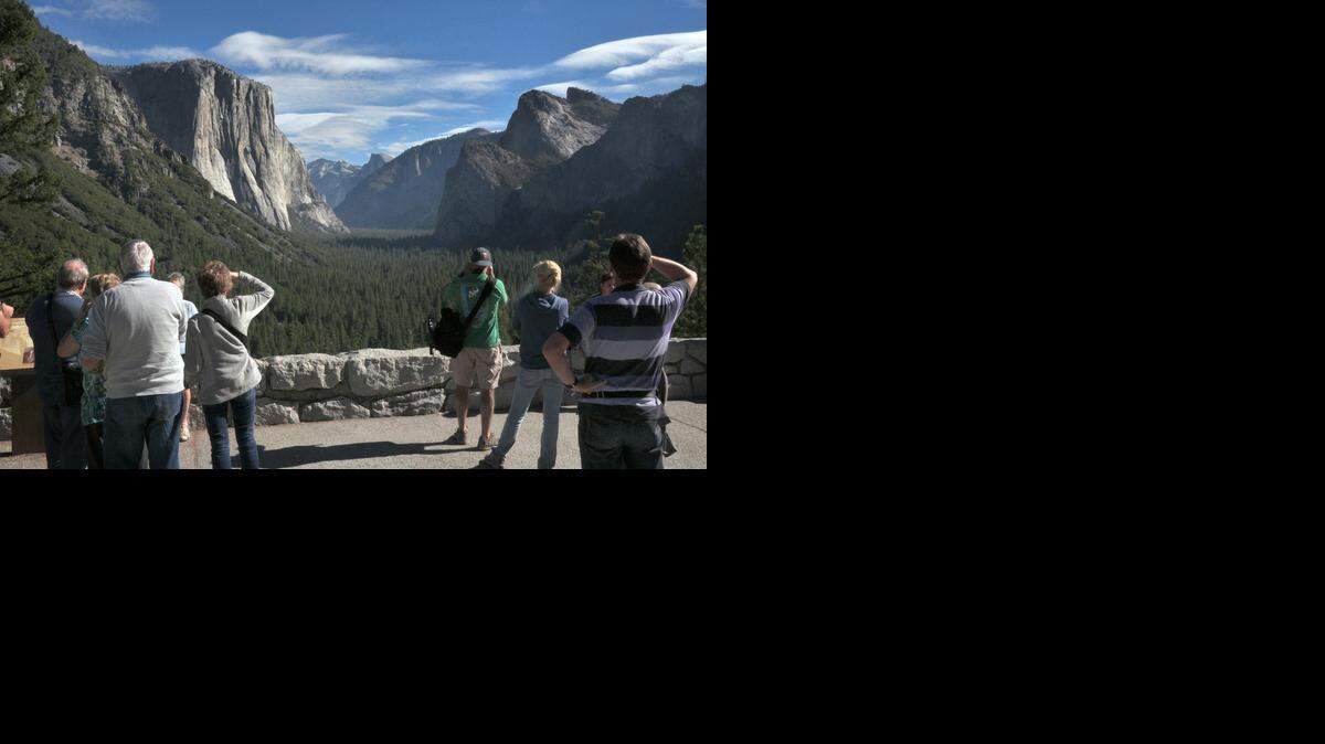 
Visitors to Yosemite National Park get a beautiful view of El Capitan and Half Dome from Tunnel View. Such views will cost more starting March 1 with an increase in park entrance and campground fees. 
