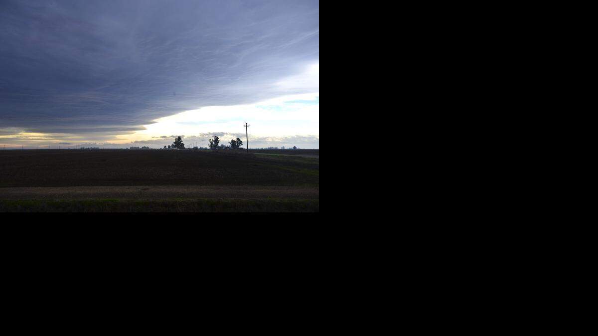 
Dark clouds roll in as high winds blow through Merced on Thursday.
