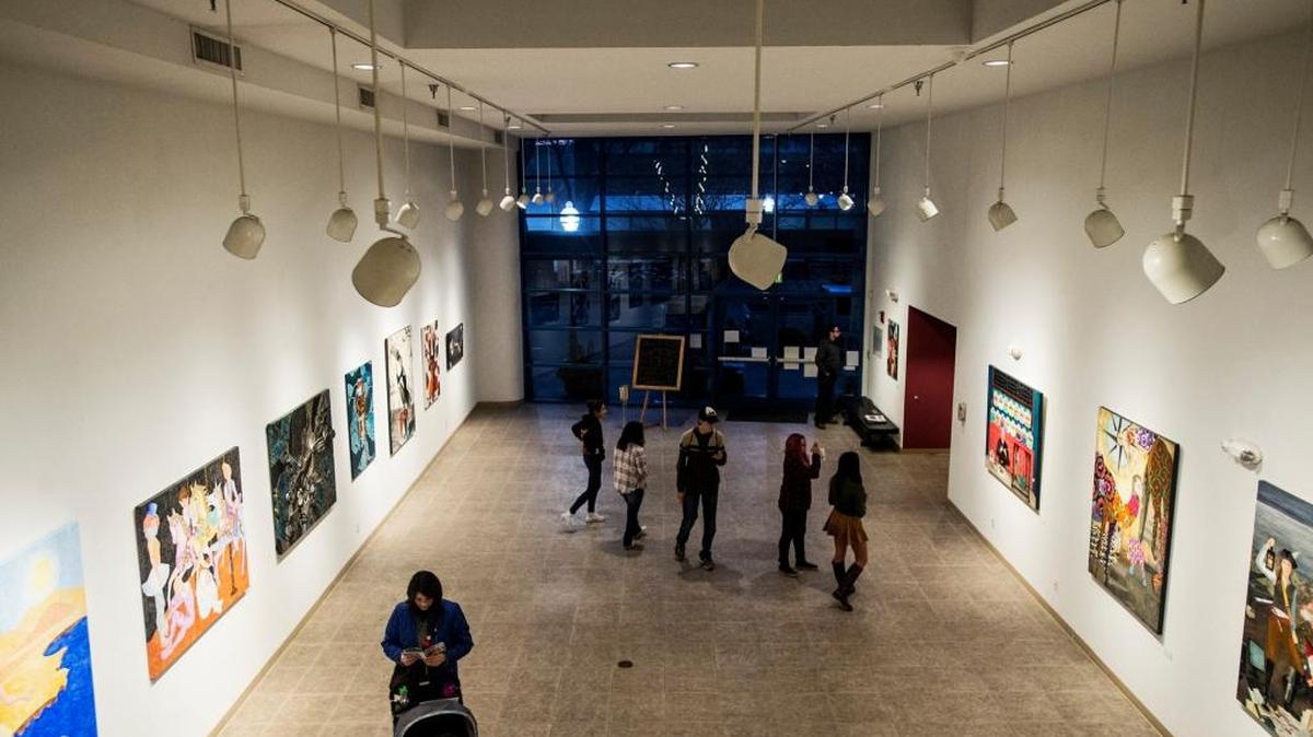 Patrons check out artwork inside the Merced Multicultural Arts Center during the Merced Art Hop in January.