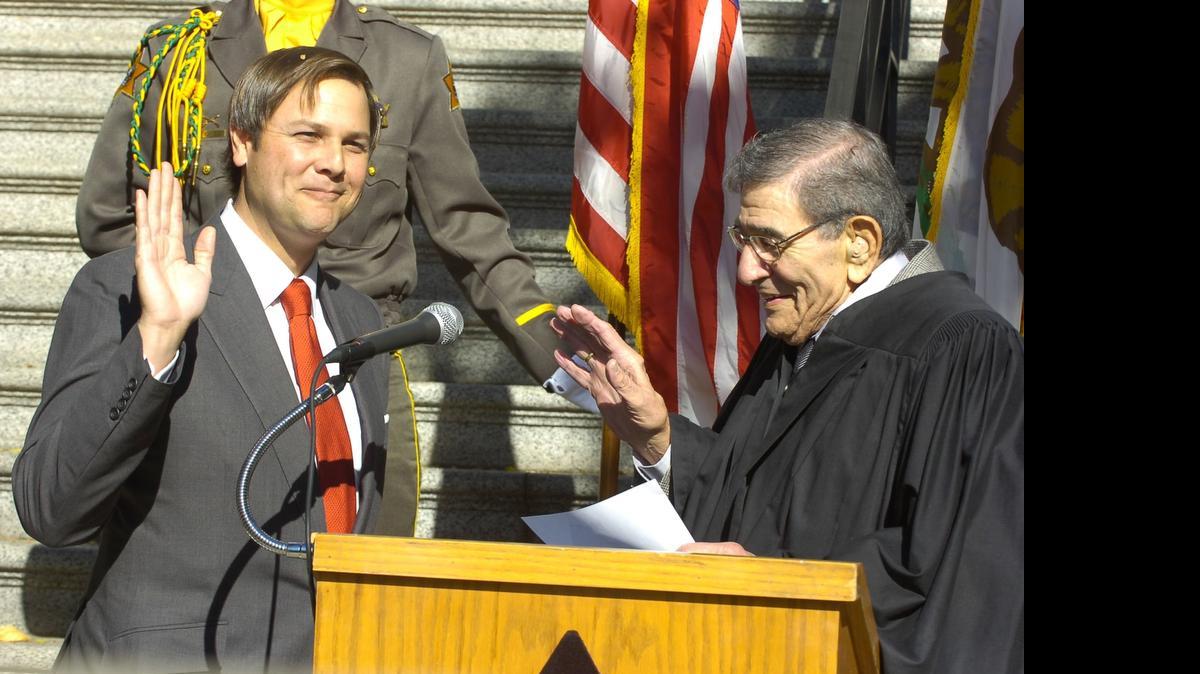 
Marc A. Garcia, pictured here during his swearing-in ceremony Nov. 30, 2007 by Superior Court Judge Roberte Falasco. Garcia, 46, has resigned from the Superior Court bench.


