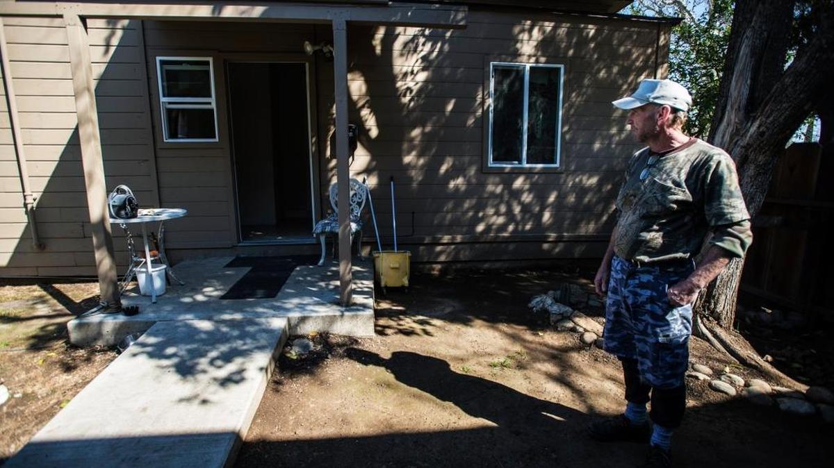 United States military veteran Ken Roark, 54, of Merced, speaks about his experience being homeless outside his new home in Merced, Calif., Tuesday, March 3, 2015. Roark, who was previously homeless, acquired the residence through the Sierra Saving Grace Homeless Project.