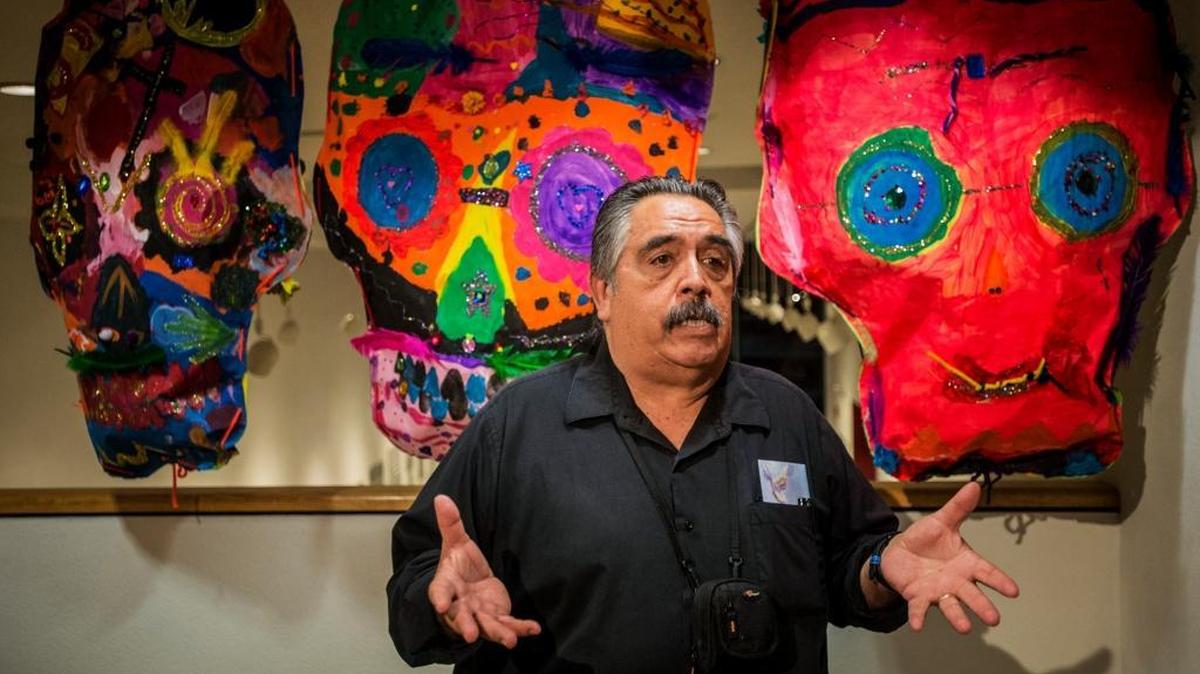 
Merced Multicultural Arts Center curator Ruben A. Sanchez speaks about the “Day of the Dead” exhibit during the Merced Art Hop in downtown Merced on Saturday, Oct. 17, 2015.
