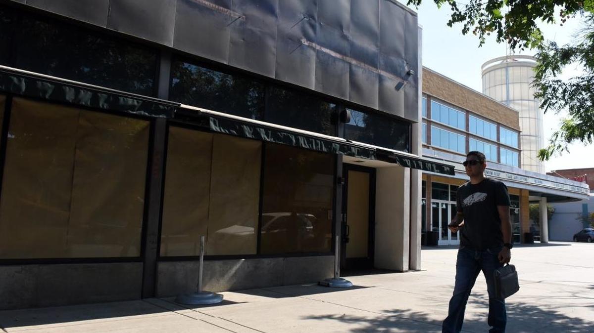 Esai Covarrubias, 20, of Delhi walks past the recently shuttered Starbucks on Main Street on Tuesday, Aug. 30, 2016, right after finding out the location has been closed. “It’s kind of disappointing,” the Merced College student said.