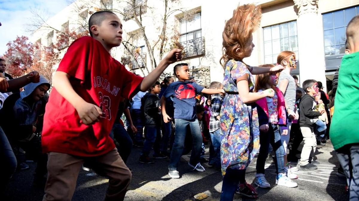 Children dance to Silento’s “Watch Me (Whip/Nae Nae)” during this year’s Cheerful Giving event in downtown Merced on Saturday, Dec. 12, 2015.