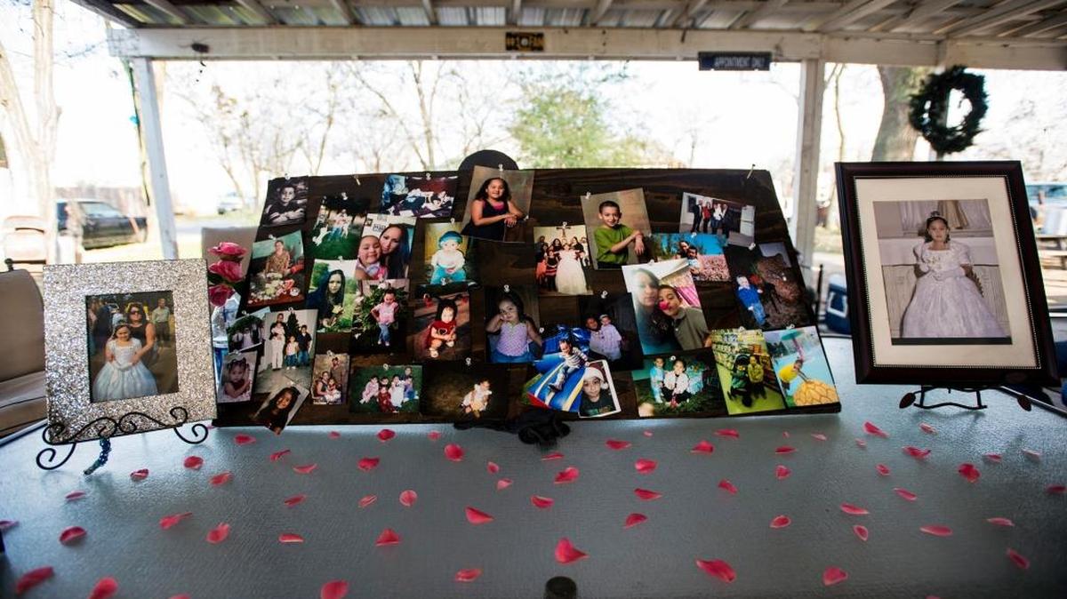 Photos are displayed of the Hernandez family as relatives gather to remember them in Winton on Tuesday, Feb. 16, 2016. Mario Hernandez; his wife, Blanca; and their children, daughter Nayeli, 9, and son Jonathan, 6, were found dead in a truck that crashed into an irrigation canal near Snelling.