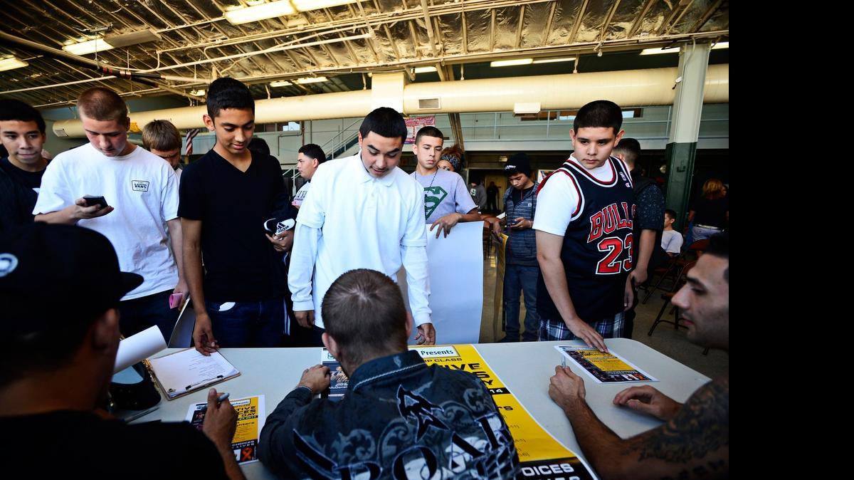 
Sequoia High School students line up for autographs from mixed martial arts fighters after a presentation during Positive Choices Day at Sequoia High School in Merced last year. The event was put on with the help of a Building Healthy Communities grant. 
