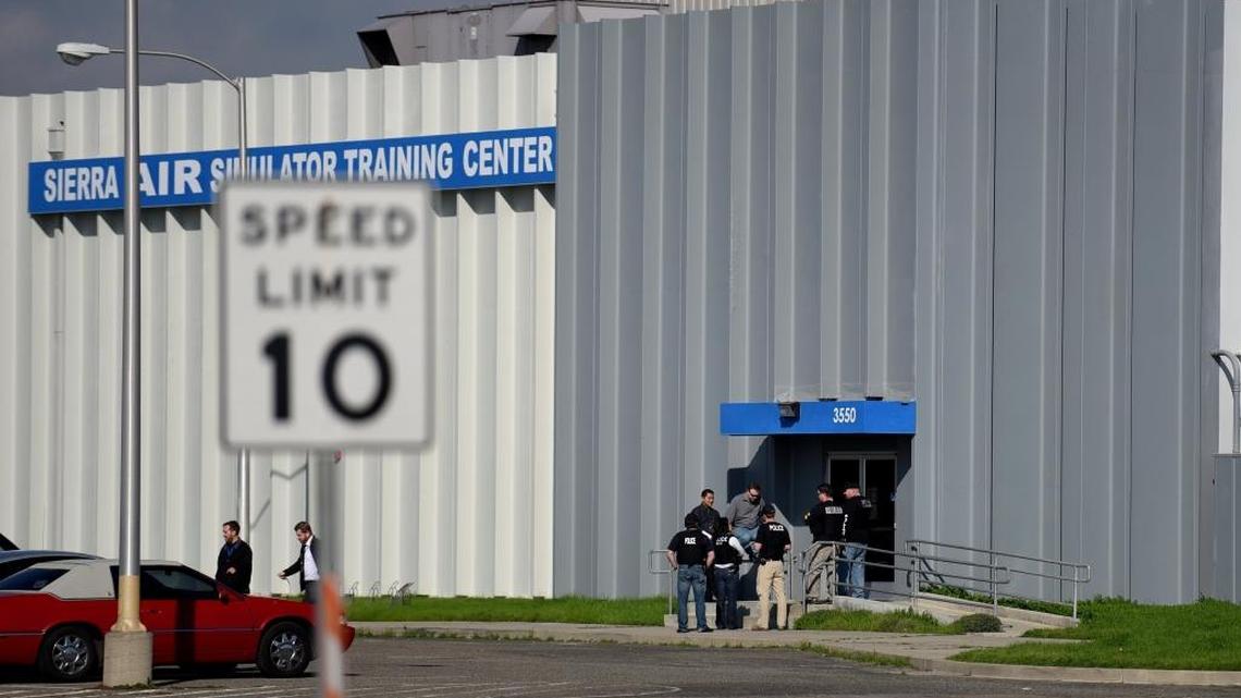 Federal agents search Sierra Academy of Aeronautics at the former Castle Air Force Base in Atwater on Monday, Jan. 26, 2016. Officials confirmed the flight school is subject to an Internal Revenue Service criminal investigation, but said it remained open and in full operation.