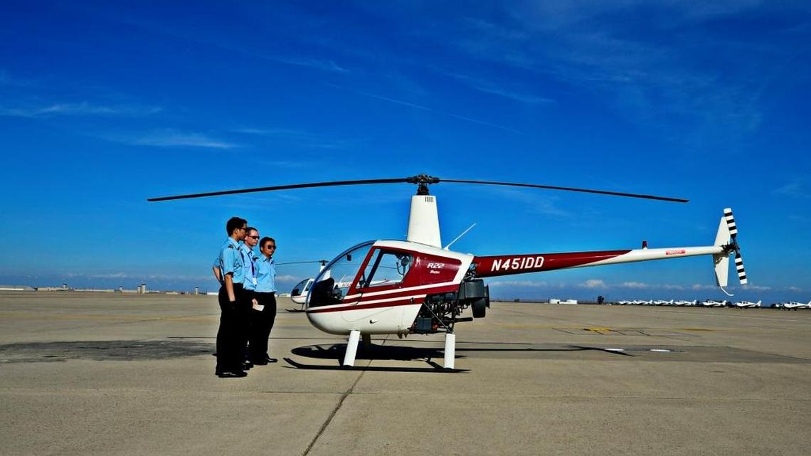 
Students stand outside a Robinson R22 helicopter at Castle Air Force Base in Atwater.
