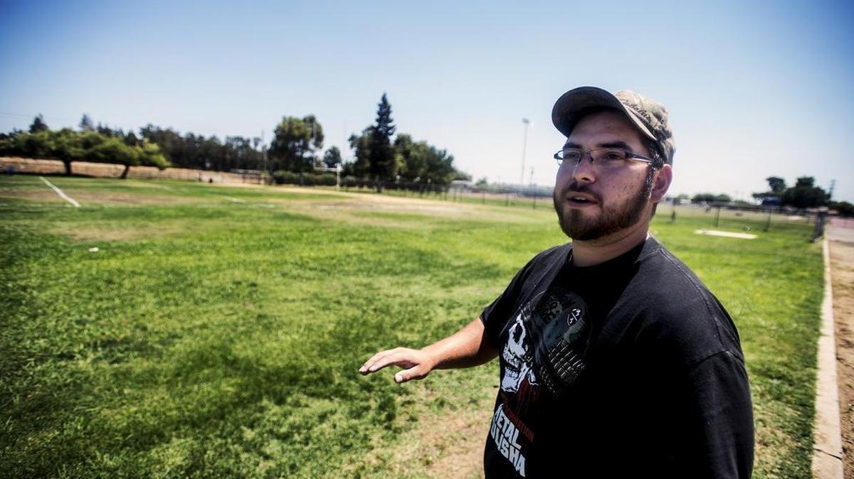 
Atwater High School grounds keeper John Sanchotena II, 23, of Merced, talks about how playing conditions can become dangerous for athletes as the grass and ground dry out at Atwater High School in Atwater, Calif., on Tuesday. The City Counsel voted in favor of allowing Atwater's high schools allowing five days of watering per week.

