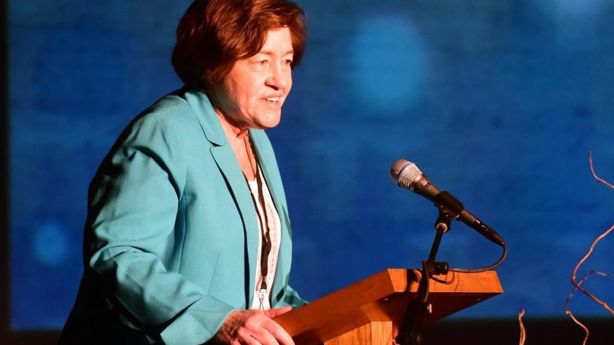 Carol Bowman, a member of the Continuum of Care, speaks about homeless housing at the Merced Homeless Summit at Merced Theatre on Friday. The Merced County count from January revealed that fewer people are living on the street.