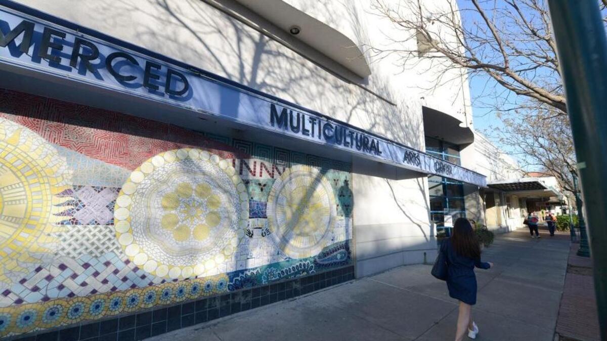 Pedestrians walk by the Merced Multicultural Arts Center, on Thursday, March 5, 2014, in Merced.
