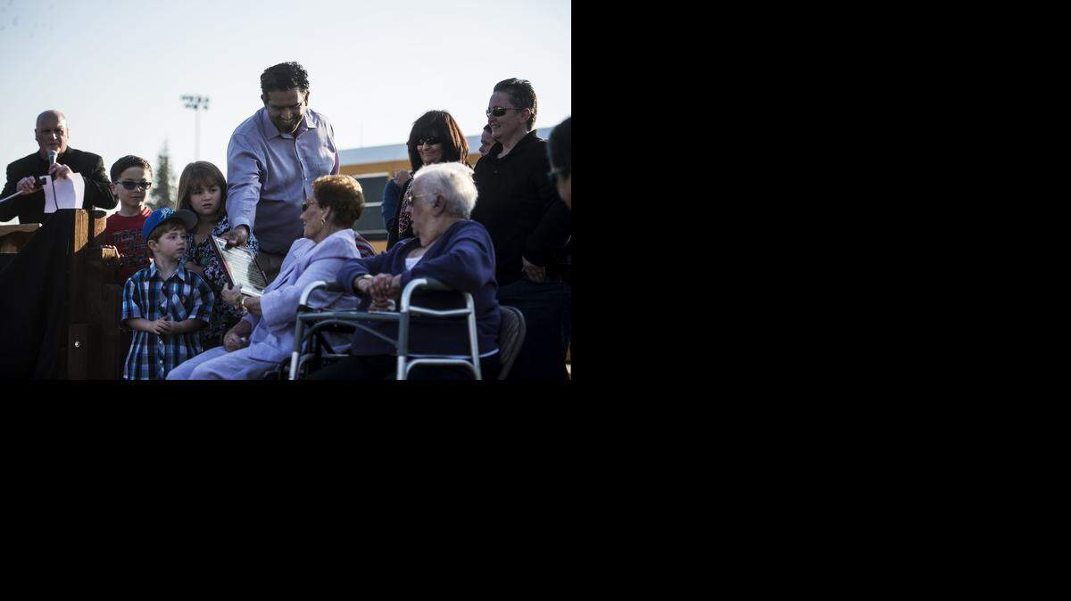 
Chowchilla Mayor John Chavez presents Edward Ray’s widow, Odessa, 93, with a plaque declaring Feb. 26 Edward Ray Day on Thursday. A city park was renamed Edward Ray Park on what would have been his 94th birthday. 
